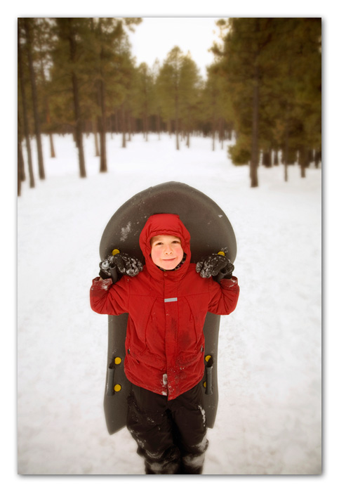 10Stock Boy with sled standing in snow Flagstaff Arizona