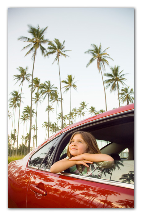 14Kauai260.jpg Girl looking up palm trees through car window Kapaa Kauai Hawaii
